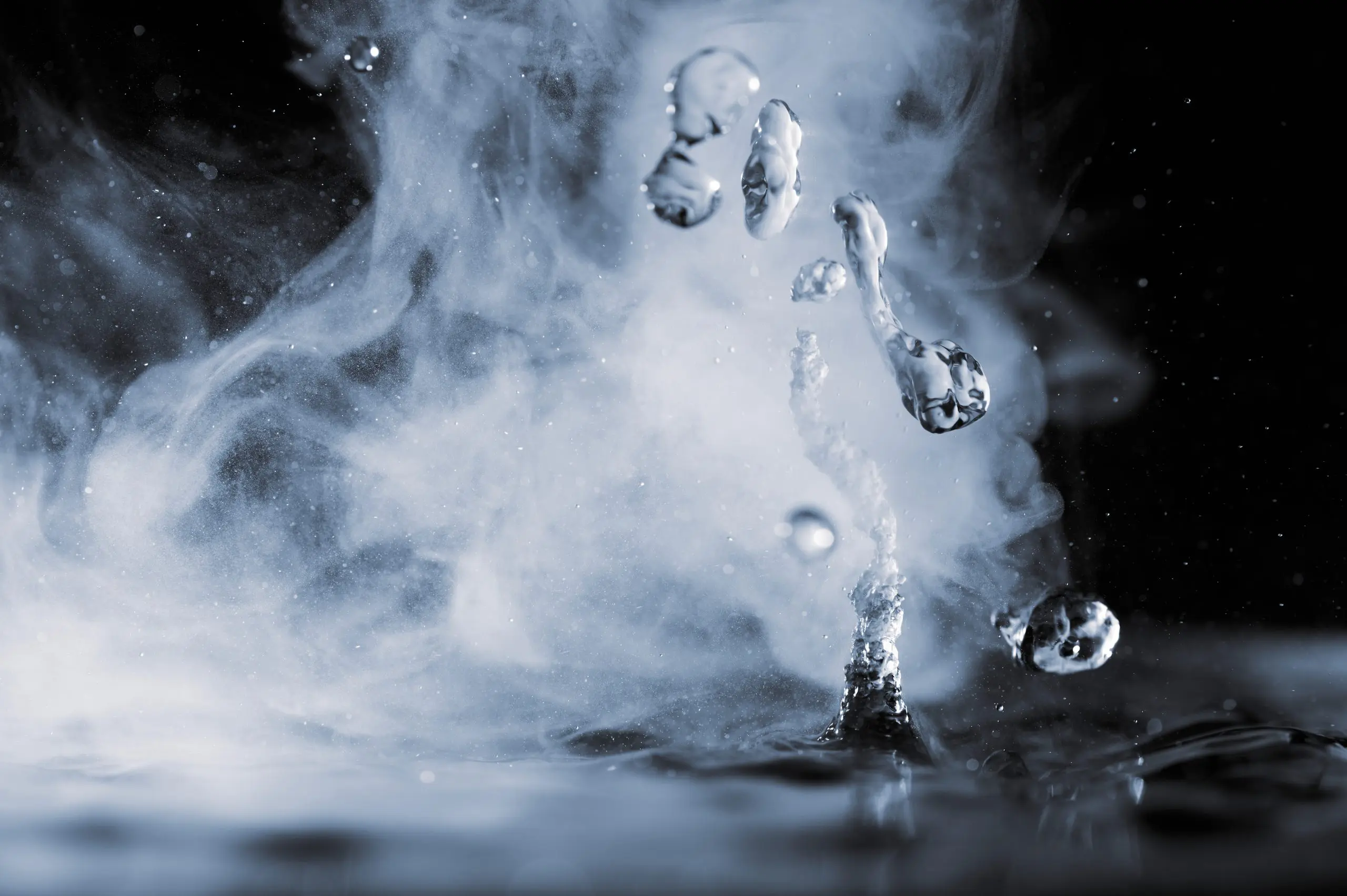 Boiling water splash with steam on black background closeup Collection of colorful powder - yellow, red, black, green, blue, white