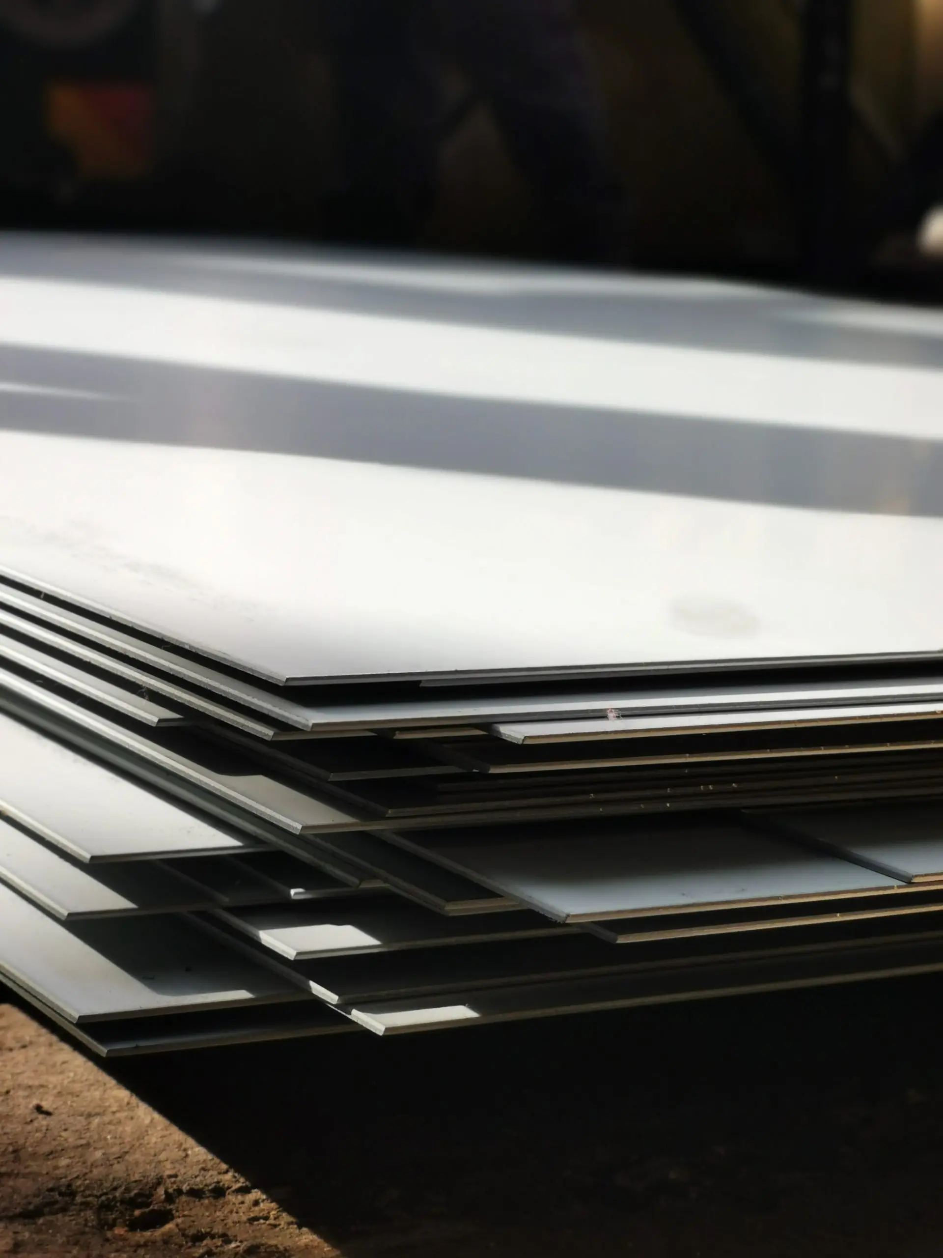 Forest landscape on a sunny day with wind turbines generating electricity in the background. Nature and ecological energy production concept.