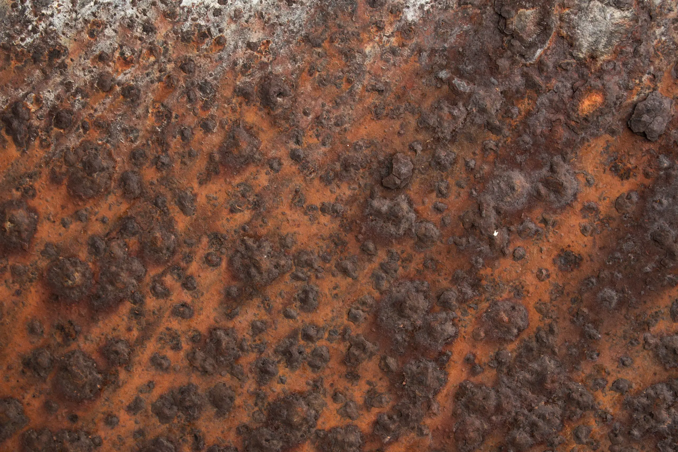 Image of a pipe join waiting to be powder coated with masking to prevent the openings being powder coated.