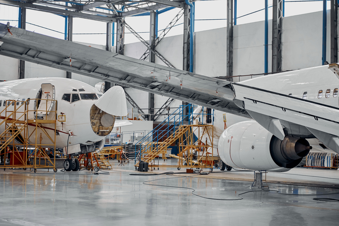 Professional plane expluatation service in big hangar